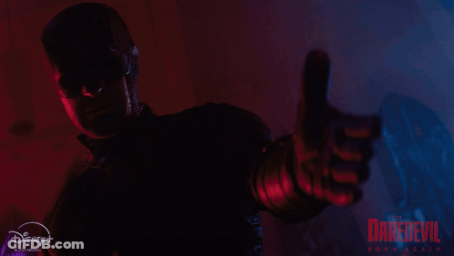 Daredevil Poster Man In Mask Holding Gun GIF