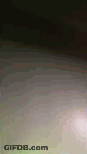 Dark Background With Spots Of Light GIF