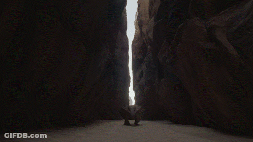 Dark Canyon With Rock In Middle GIF