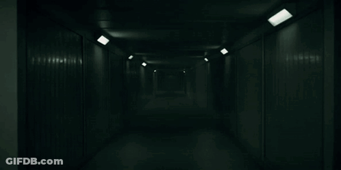 Dark Hallway With Lights On Walls GIF