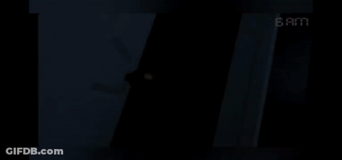 Dark Room With 6 AM Clock GIF