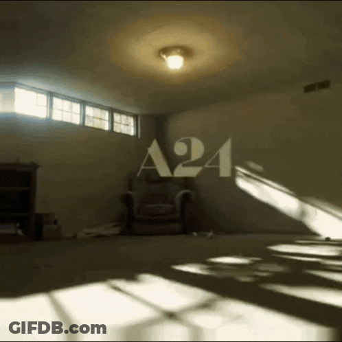 Dark Room With A24 On Wall GIF