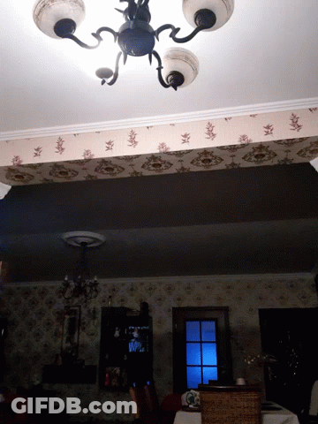 Dark Room With Chandelier And Window GIF