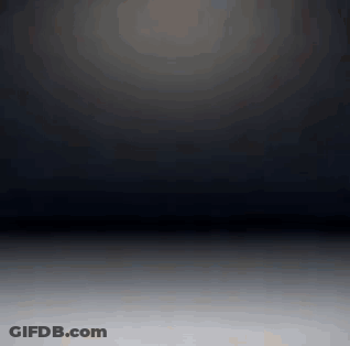 Dark Room With Light Shining On White Floor GIF