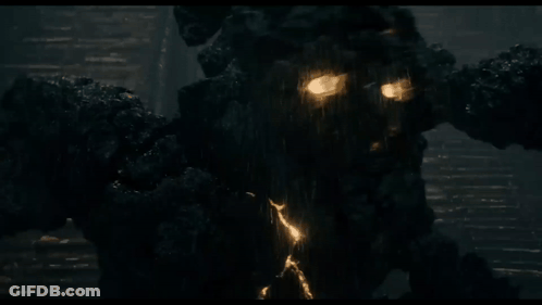 Dark Room With Statue Emitting Light GIF