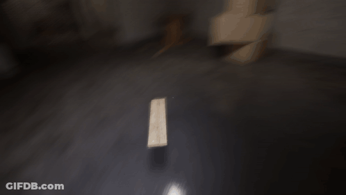 Dark Room With Wooden Table And Light On Floor GIF