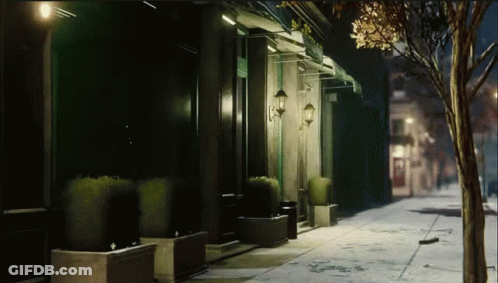 Dark Street With Building And Green Awning GIF