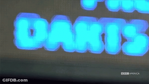 Dart Board With Word Darts Above GIF