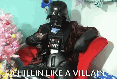 Darth Vader Cosplayer Sitting With Drink GIF