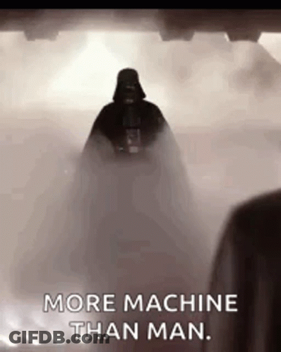 Darth Vader From Star Wars Is Standing In The Fog And Says `` More Machine Than Man '' . GIF
