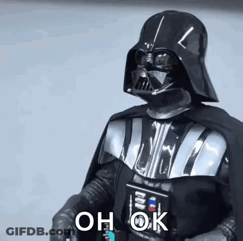 Darth Vader From Star Wars Is Wearing A Helmet And Cape And Holding A Light Saber . GIF