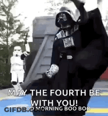 Darth Vader Is Dancing In Front Of Stormtroopers And Says `` May The Fourth Be With You ! '' GIF
