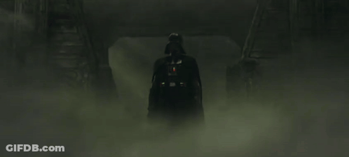 Darth Vader Is Holding A Red Lightsaber In The Fog . GIF