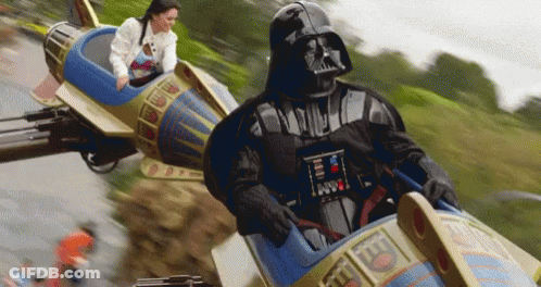 Darth Vader Is Riding A Roller Coaster With A Woman Behind Him GIF