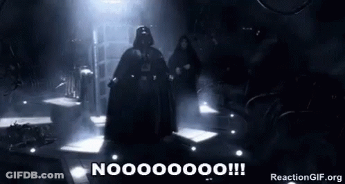Darth Vader Is Standing In A Dark Room With A Sword In His Hand . GIF