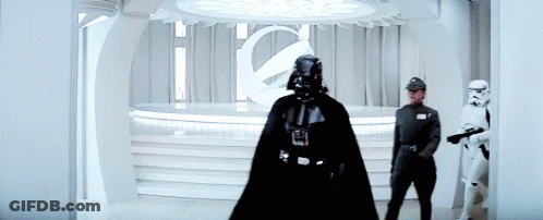 Darth Vader Is Standing In A Room With Stormtroopers . GIF