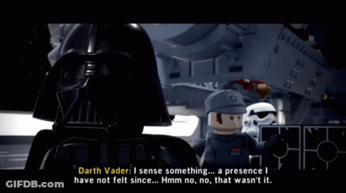 Darth Vader Is Talking To A Lego Man In Front Of A Ship GIF