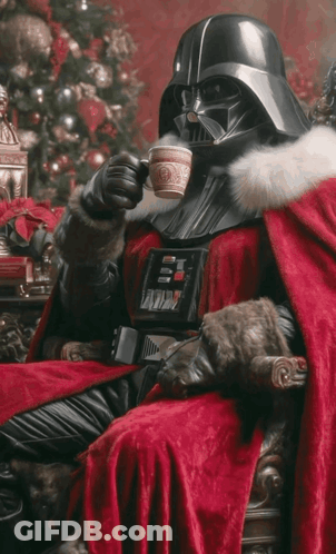 Darth Vader Sitting In Front Of A Christmas Tree Drinking From A Cup GIF