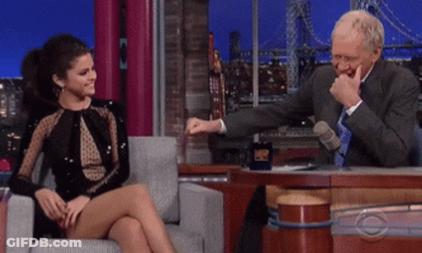 David Letterman And Selena Gomez Fist Bump With Laugh GIF