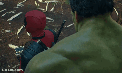 Deadpool And The Hulk Are Standing Next To Each Other In A Forest . GIF