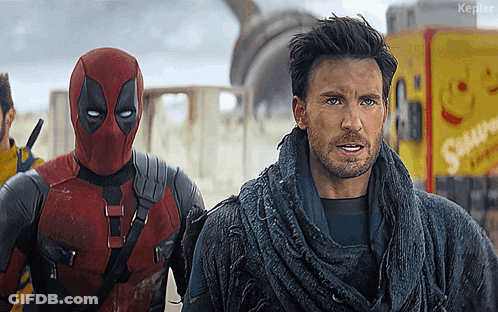 Deadpool Costume Next To Man In Sweater GIF