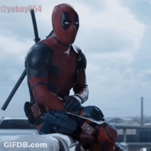 Deadpool Is Sitting On A Ledge With A Sword In His Hand And The Hashtag @ Yoboy654 GIF