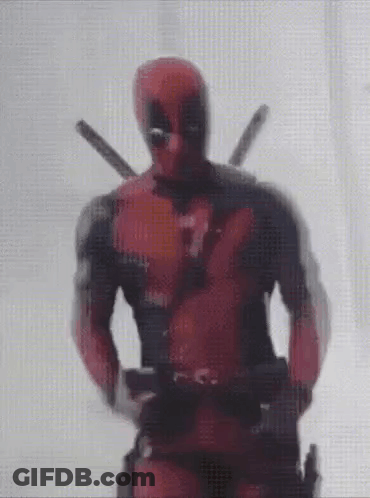Deadpool Is Standing In Front Of A Window Holding A Gun . GIF
