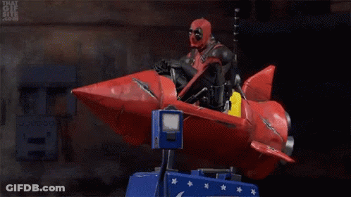 Deadpool Riding Red Rocket On Carousel GIF