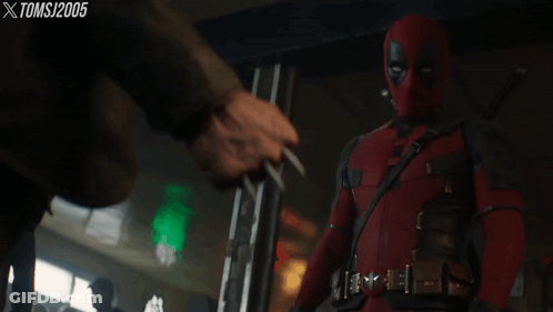 Deadpool Standing In Front Of Man Holding Knife Tomsj 2005 GIF