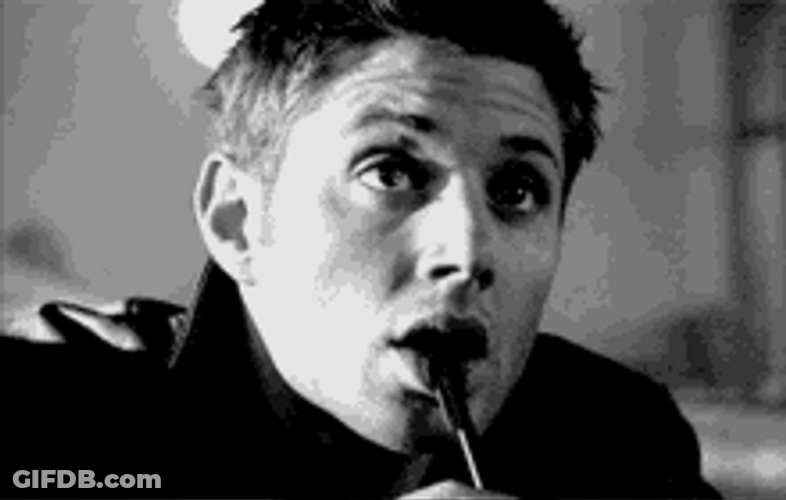 Dean Winchester Biting Pen Smiling GIF