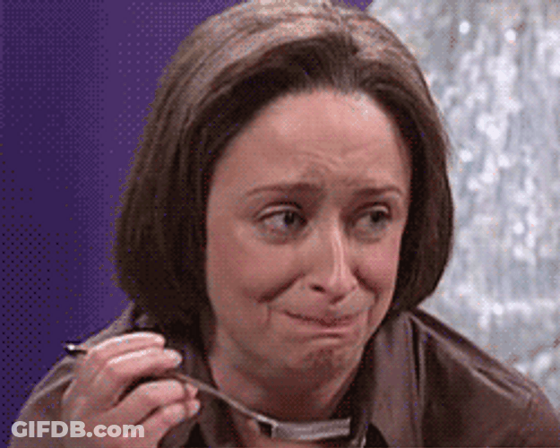 Debbie Downer Eating & Smirking GIF