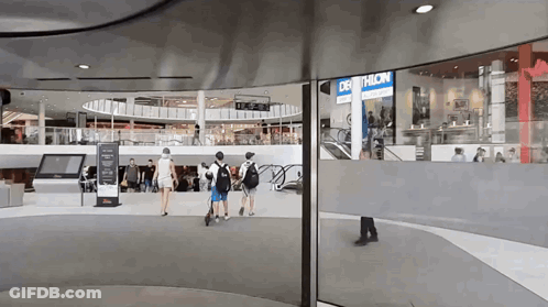 Decathlon Store In Mall With People Walking GIF