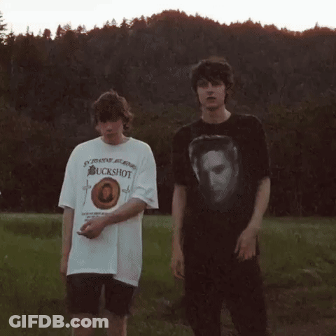 Deer Standing Next To Rabbit In Field GIF