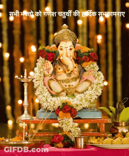 Deity Statue With Flowers GIF