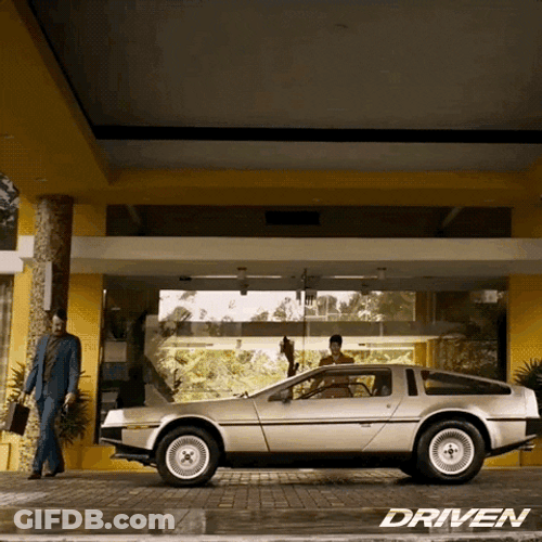 Delorean Parked In Front Of Building GIF