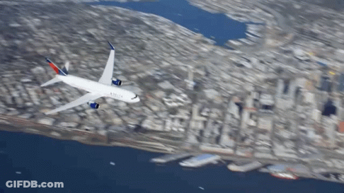 Delta Airplane Flying Over City GIF