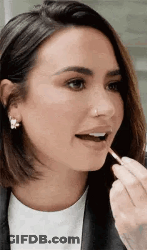 Demi Lovato Putting Lipstick GIF