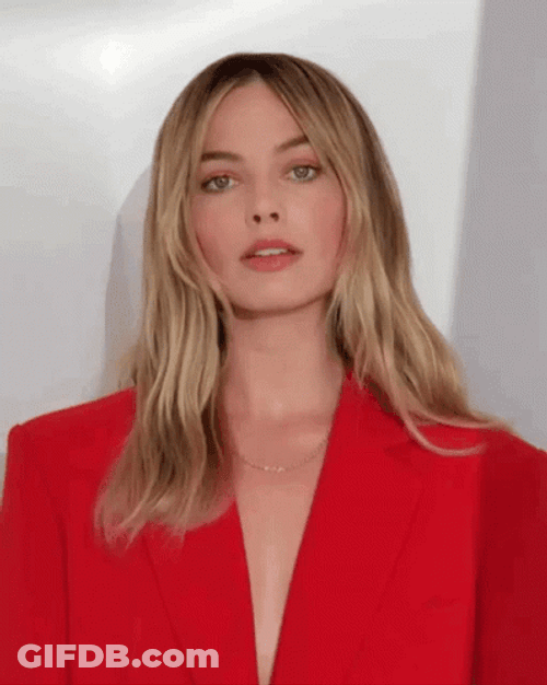 Demure Margot Robbie Red Suit GIF