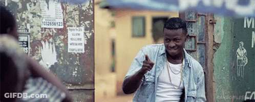 Denim Shirt Man Pointing Near M Sign GIF
