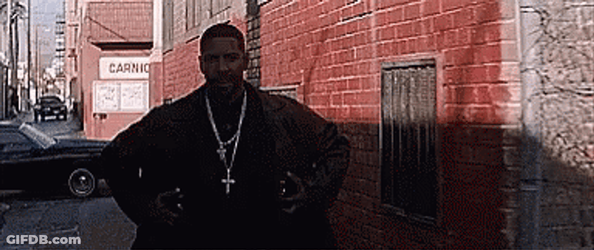 Denzel Washington Hiding Weapons Under Coat GIF