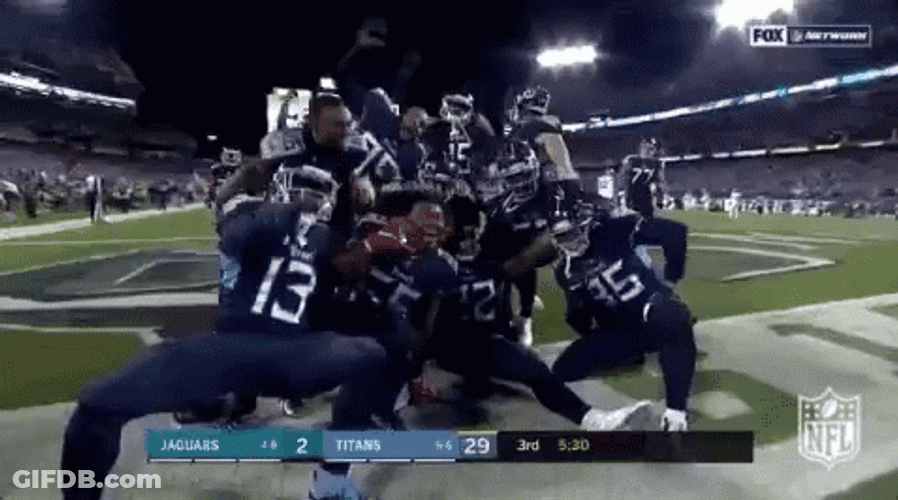 Derrick Henry Stiff Arm Posing With Team GIF
