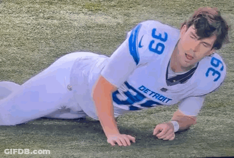 Detroit Football Player Laying On Field GIF