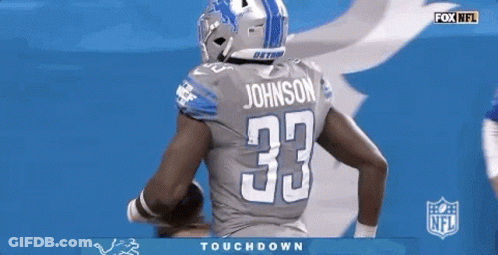 Detroit Lions Football Player Holding A Football GIF