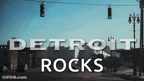 Detroit Rocks Sign Hanging From Street Light GIF