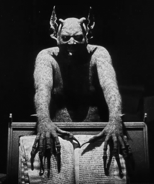 Devil Covering Paper GIF