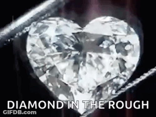 Diamond Heart Held In Tweezers GIF