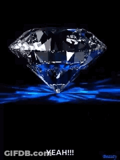 Diamond With Blue Light On Black Background GIF