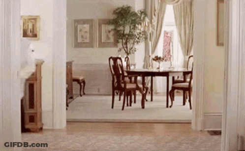 Dining Room With Table Chairs And Plant GIF
