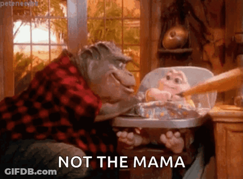 Dinosaur Feeding Baby In High Chair Saying Not The Mama GIF
