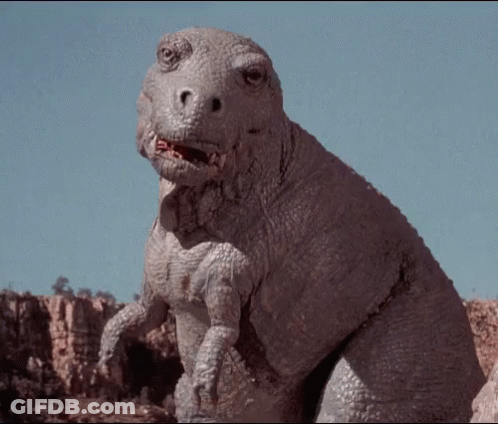 Dinosaur Looking At Camera With Mouth Open GIF